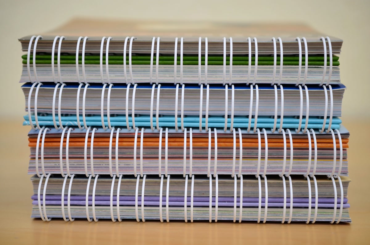 Beginner coloring setup with colored pencils and simple book