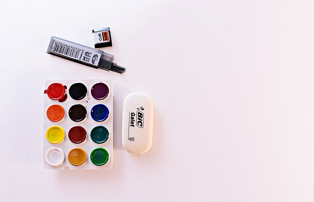 Beginner coloring supplies spread out on table