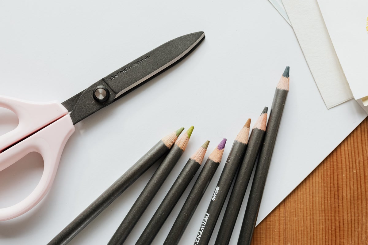 photograph of premium watercolor pencils arranged on a desk