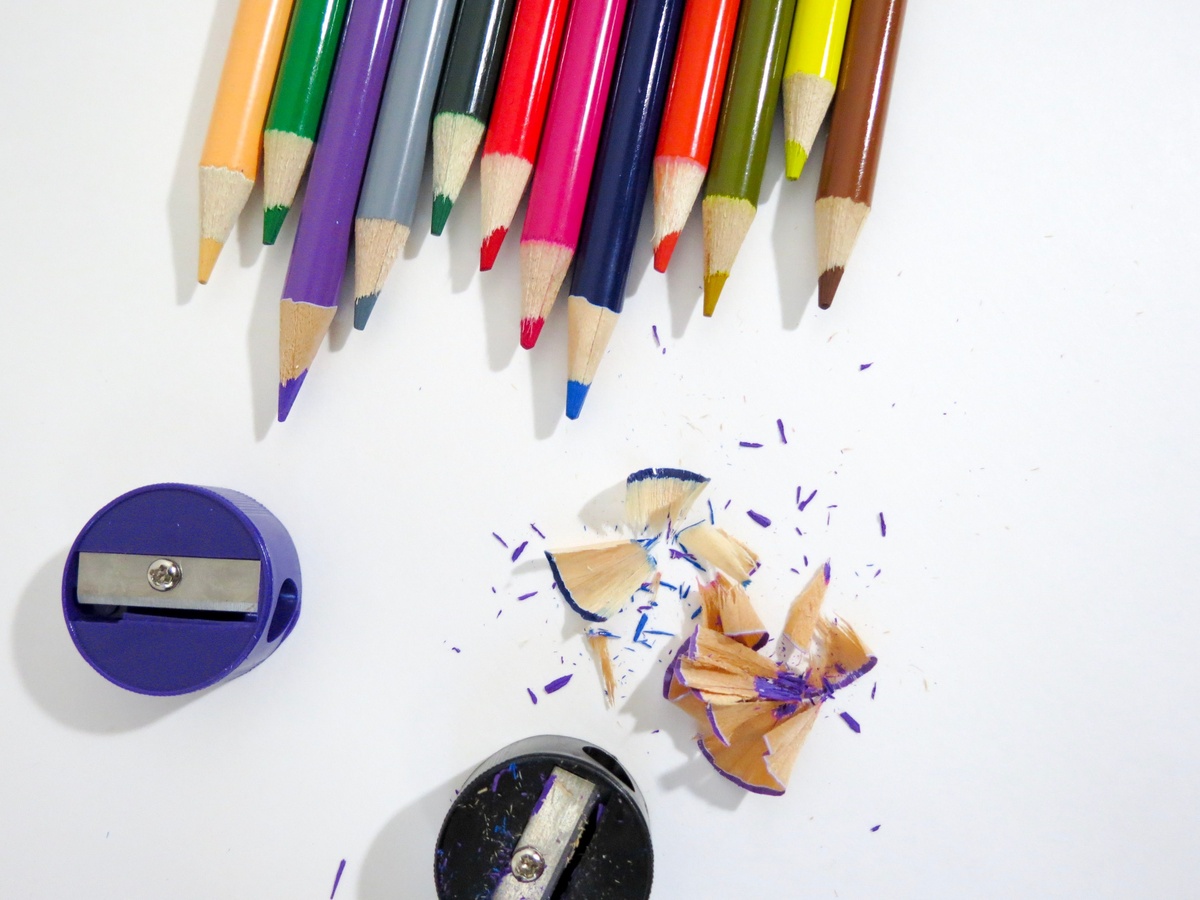 Kum Automatic Long Point sharpener with a perfectly sharpened colored pencil