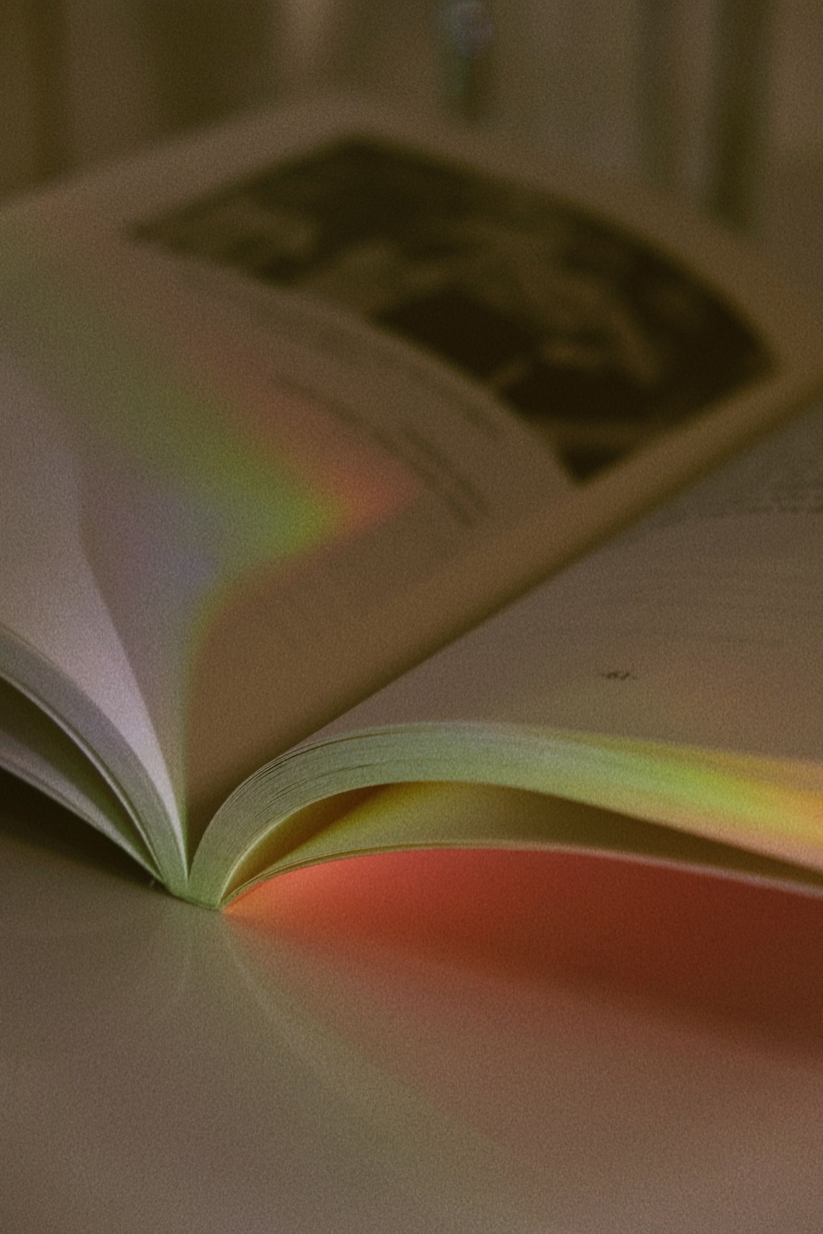 A coloring book open to a beautifully colored page on thick bright white paper, Prismacolor pencils beside it, the finished work vibrant and clean with no bleed-through, lifestyle photography