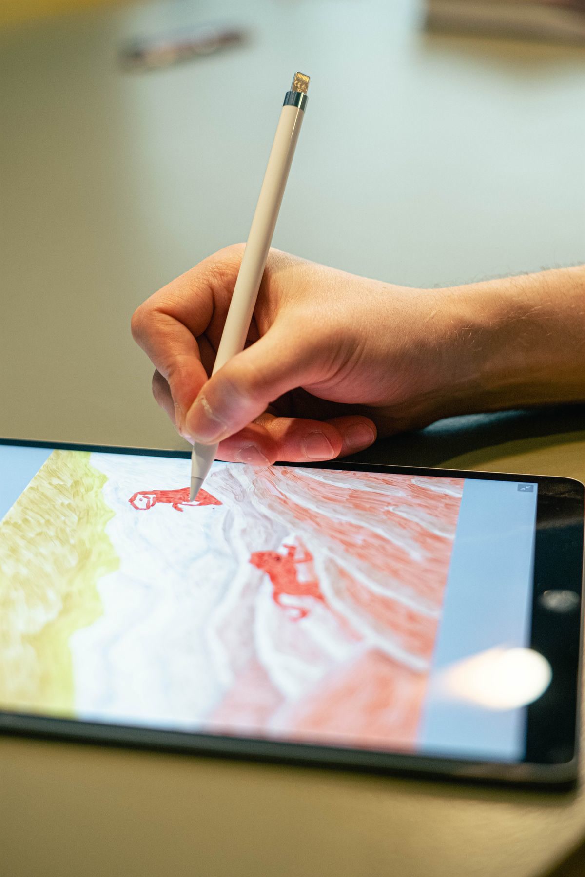 Hands using a tablet with stylus