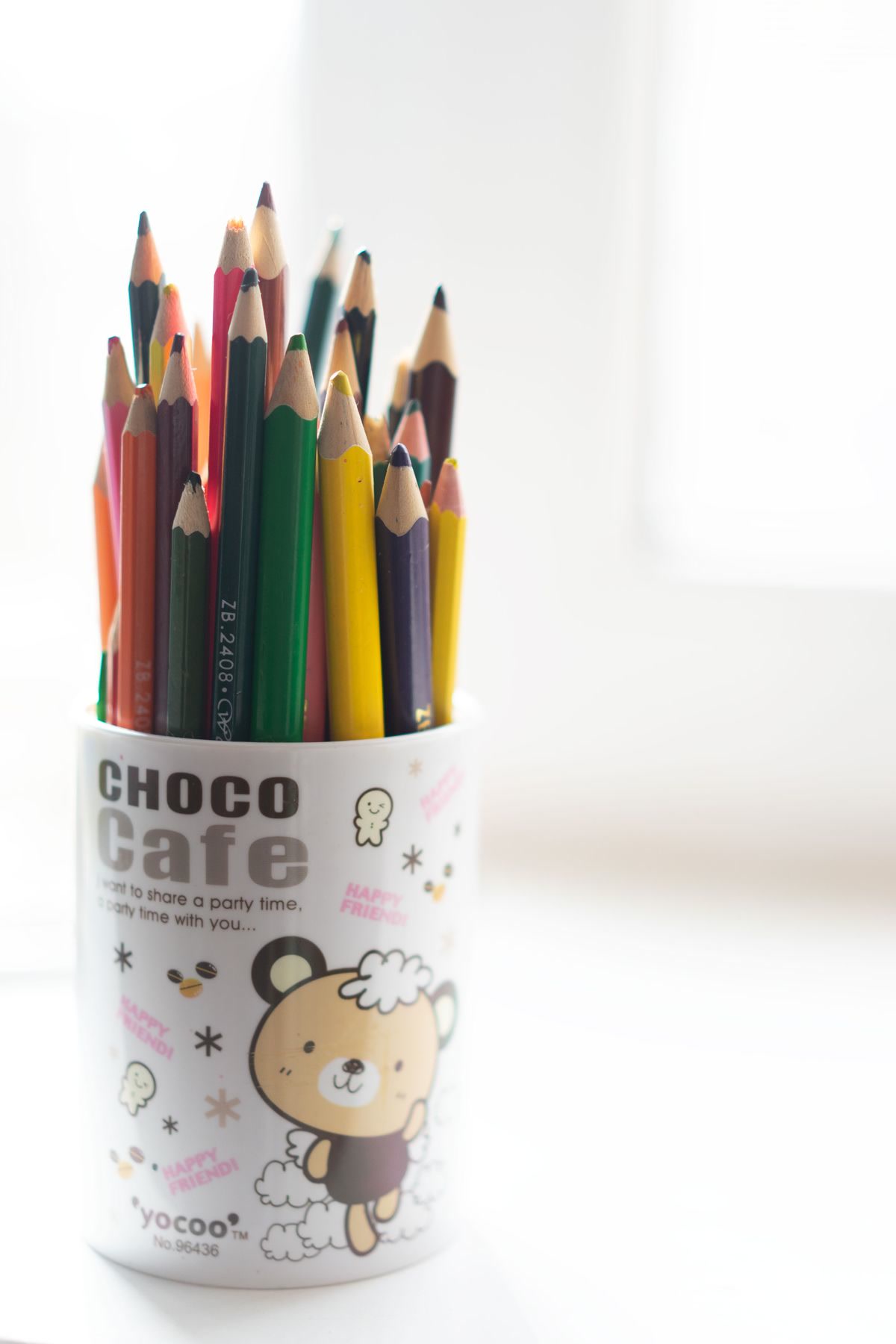 Art supplies and colored pencils on a workspace