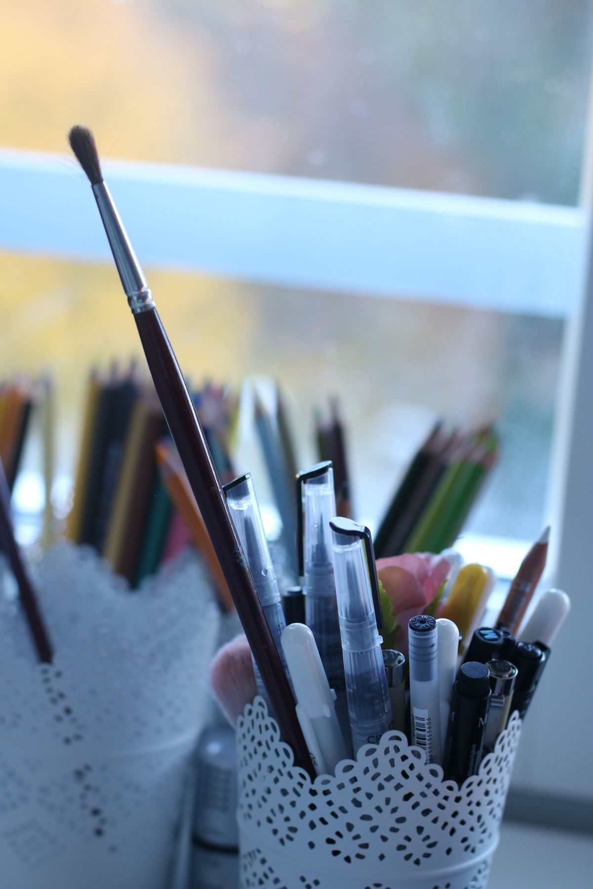 Art supplies and frames on a desk