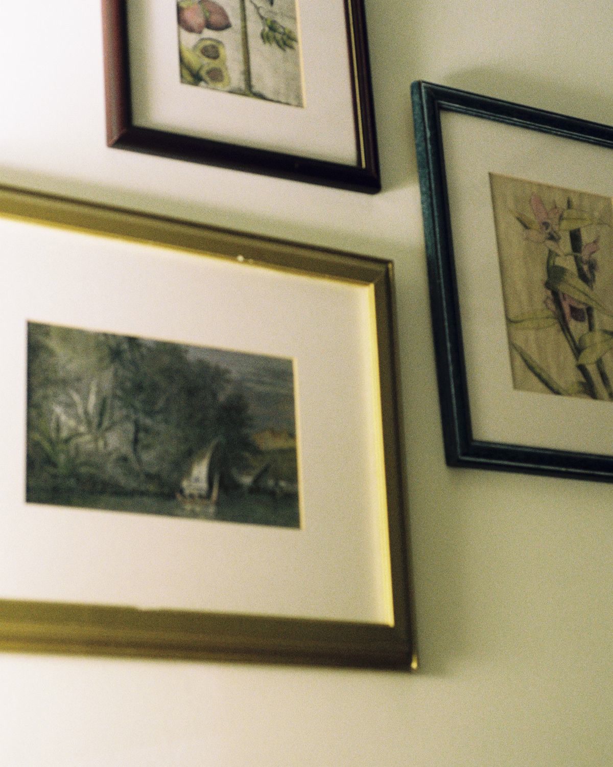 Gallery wall with multiple framed pieces