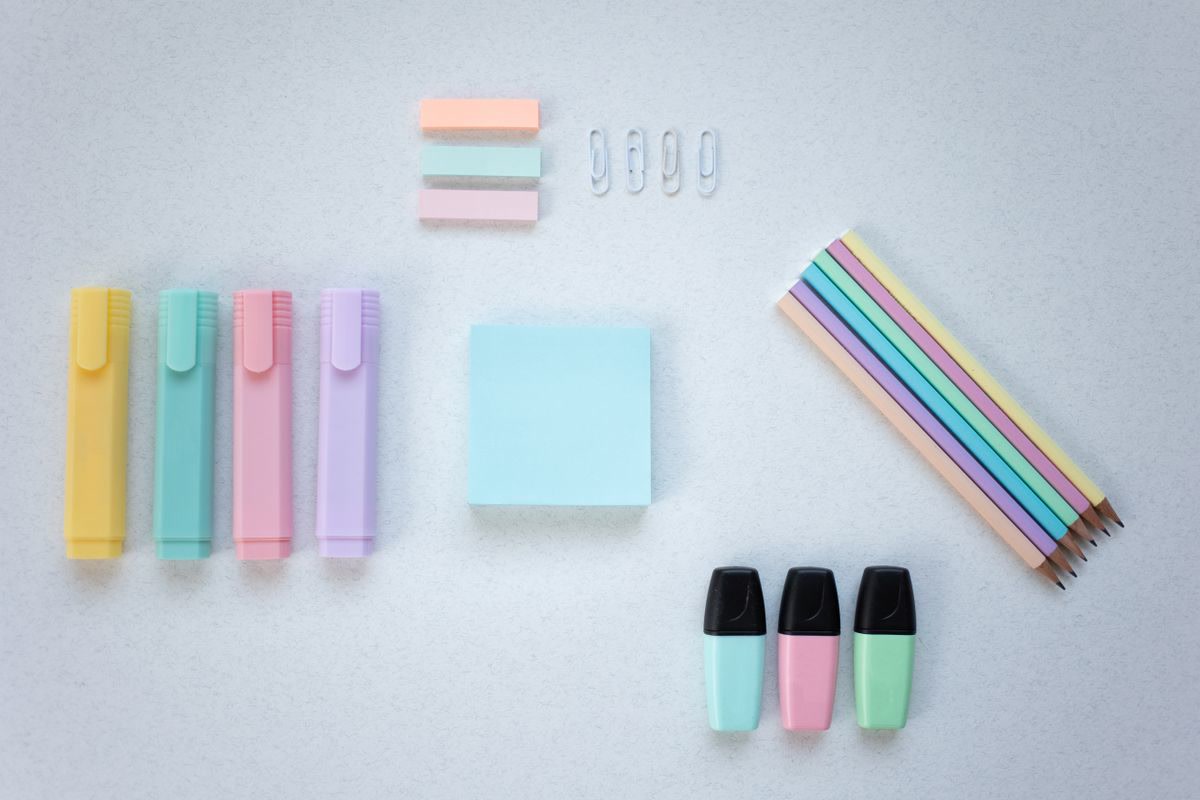 Art supplies and markers on a workspace
