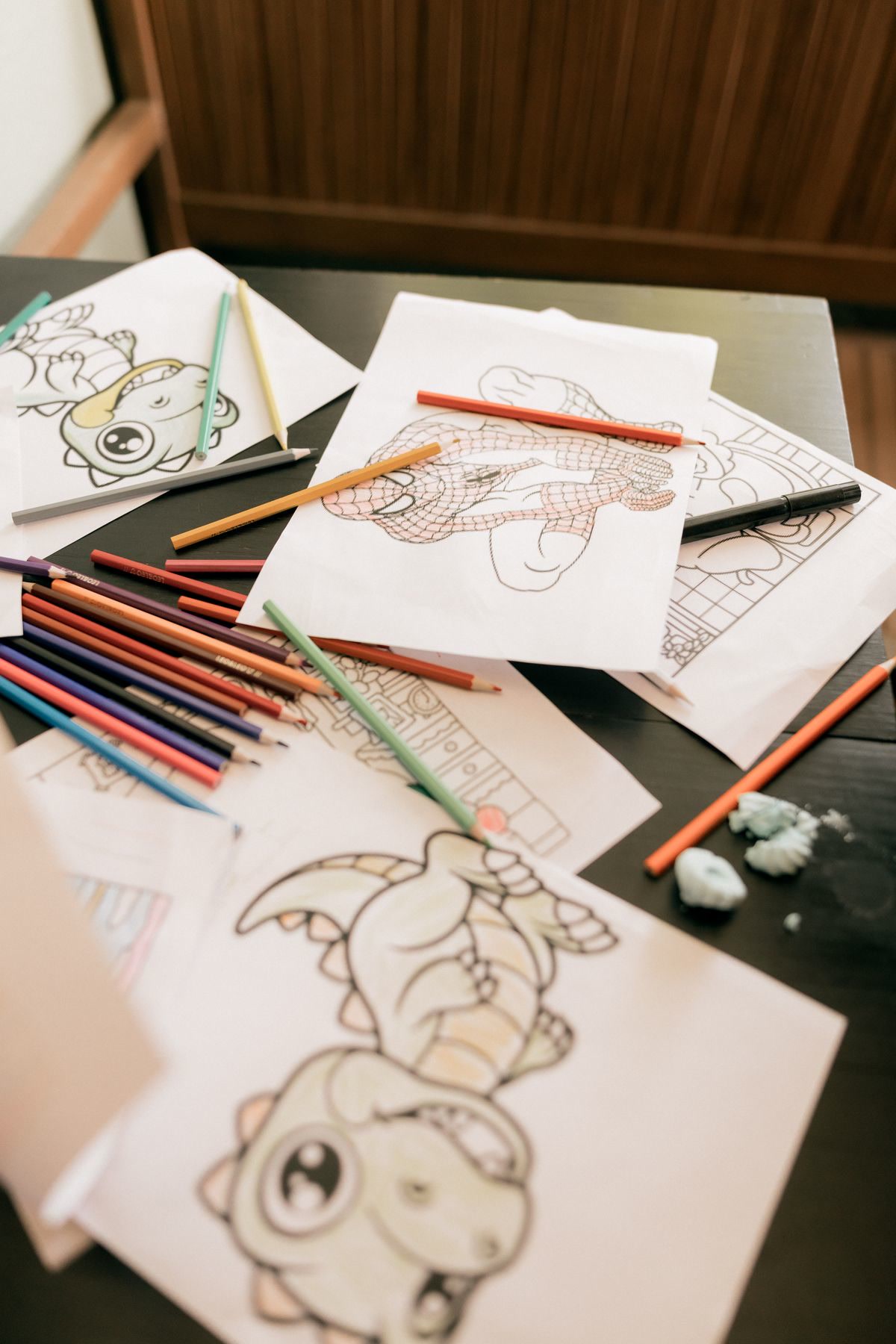 Open coloring book with art supplies