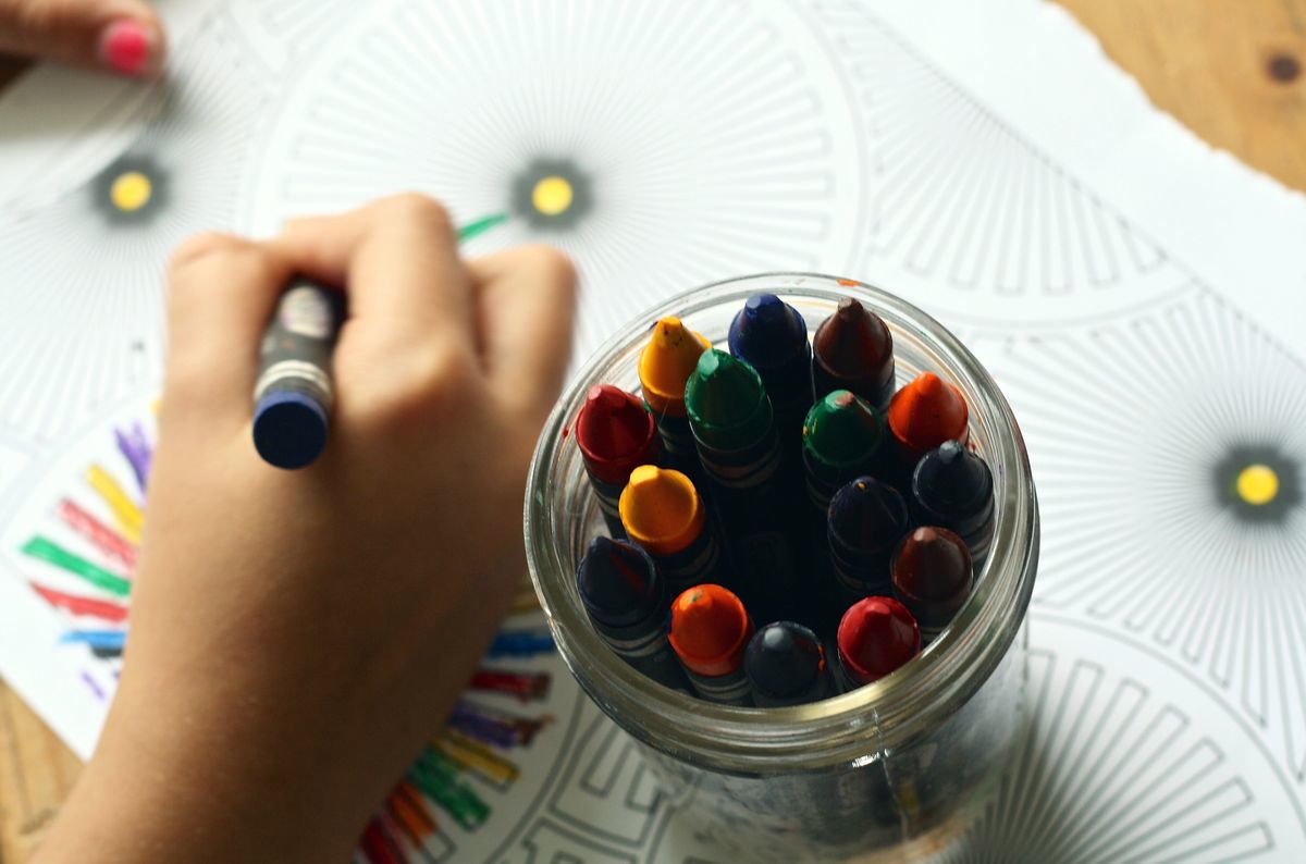 Coloring book with crayons and supplies
