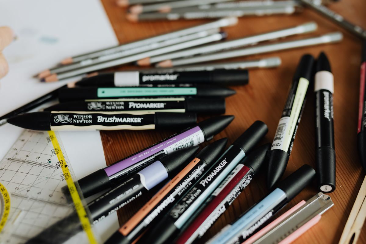 Art supplies and colored pencils on a desk