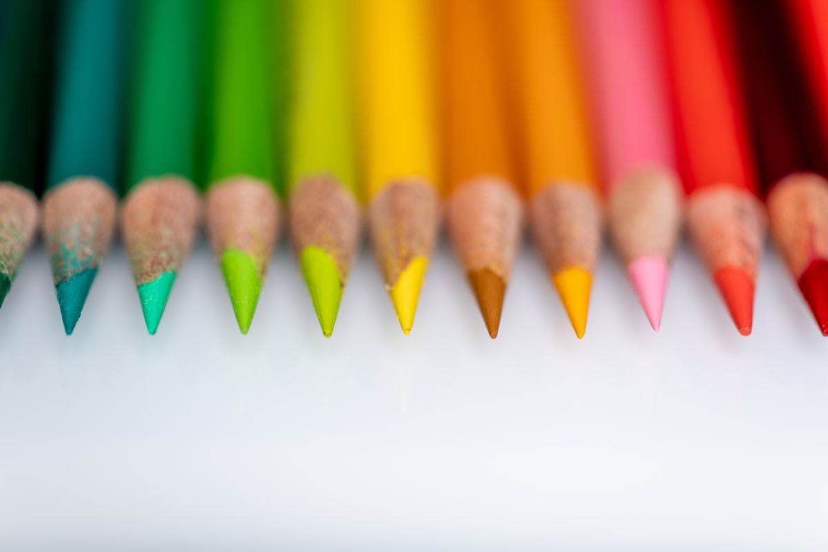 Hands coloring with colored pencils